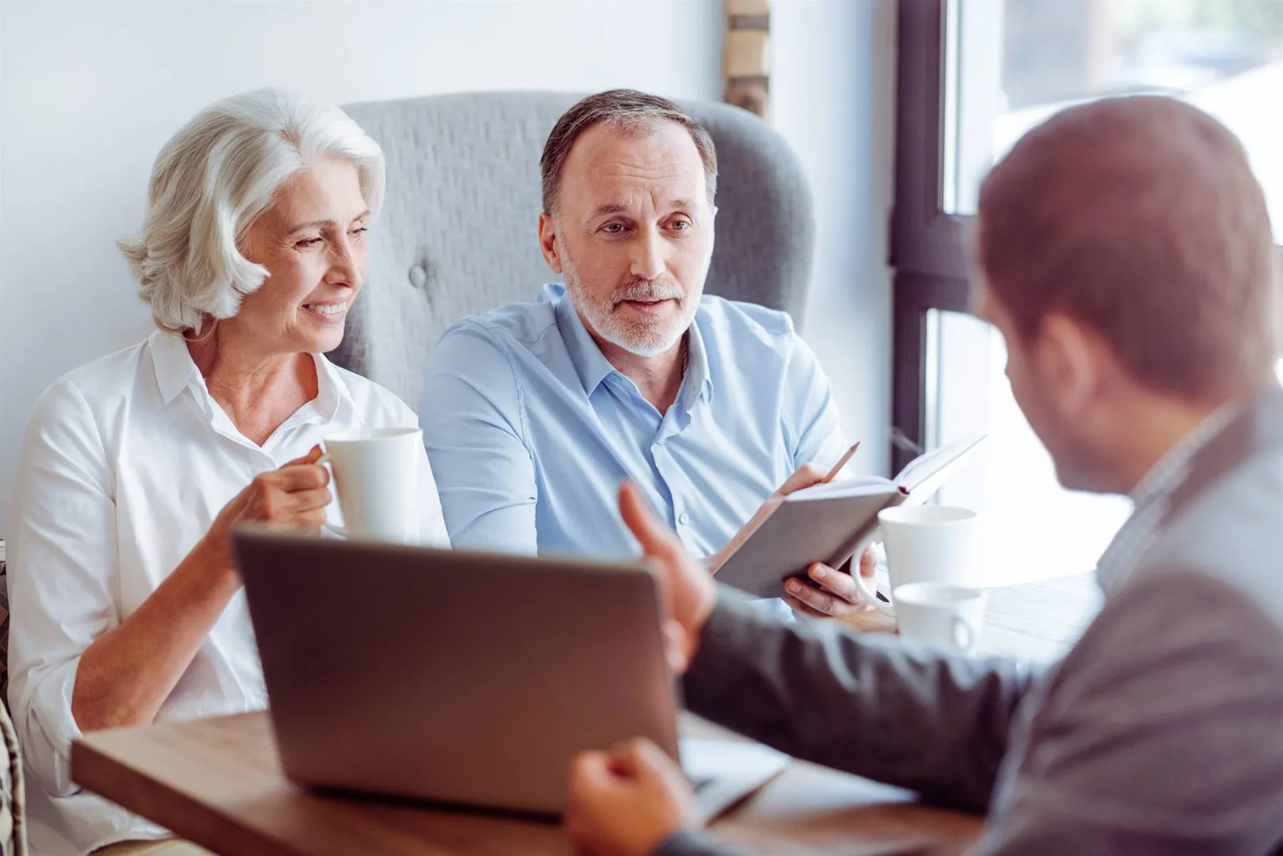 The Crossbridge team in conversation with a business owner